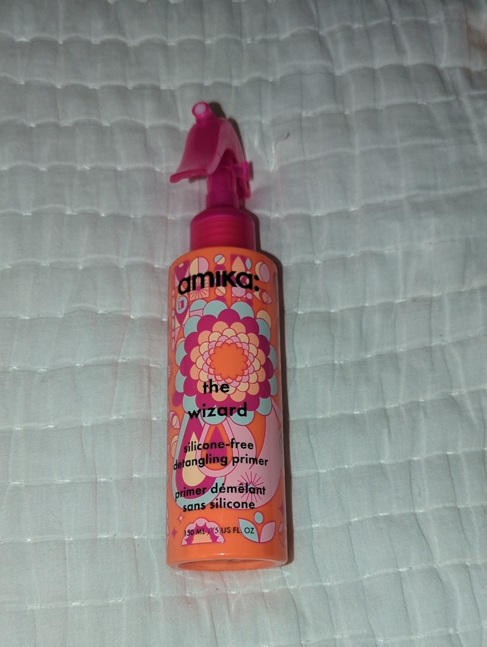 amika Detangling Primer in Pink and Orange